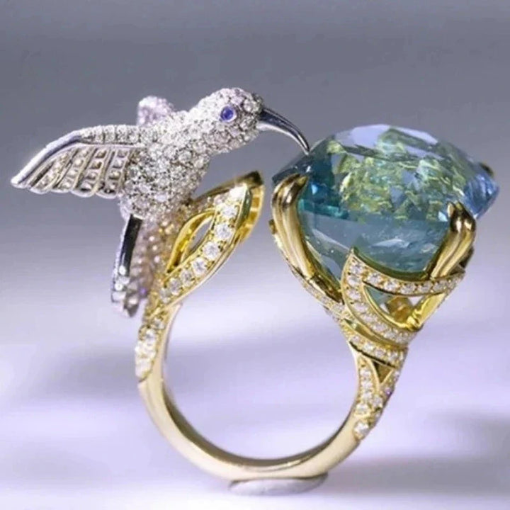 Anello Regolabile Colore Acquamarina con Colibrì – Placcato Oro 14K