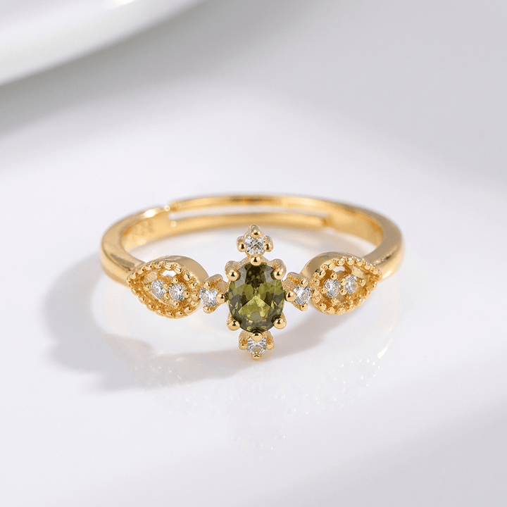 ANELLO D'ORO REGOLABILE CON CRISTALLO VERDE OLIVA - (REGOLABILE)